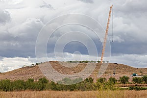 Crane for the construction of a wind turbine in the middle of the field