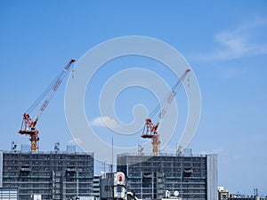 Crane Equipment Construction site Blue sky Building Construction