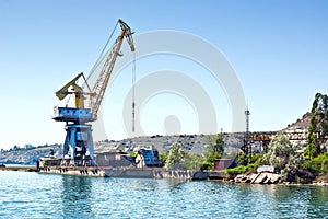 The crane on the floating dock in the harbor.