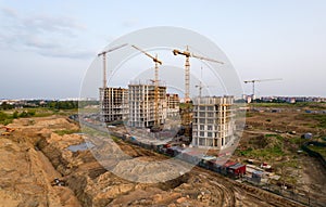 Crane during formworks. Aerial View of a large construction site. Tower cranes in action. Housing renovation concept. Construction