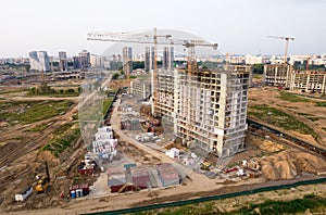 Crane during formworks. Aerial View of a large construction site. Tower cranes in action. Housing renovation concept. Construction