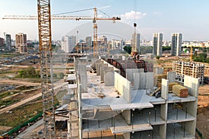 Crane during formworks on construction site. Pouring concrete into formwork. Construction the buildings and multi-storey