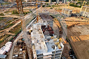 Crane during formworks on construction site. Pouring concrete into formwork. Construction the buildings and multi-storey