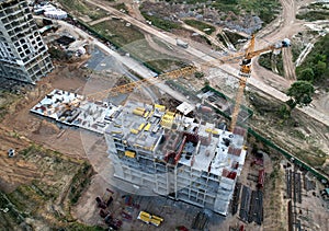 Crane during formworks on construction site. Pouring concrete into formwork. Construction the buildings and multi-storey