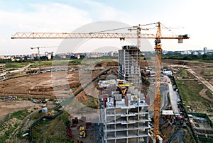 Crane during formworks on construction site. Pouring concrete into formwork. Construction the buildings and multi-storey