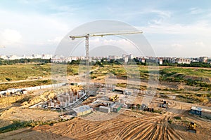 Crane during formworks on construction site. Pouring concrete into formwork. Construction the buildings and multi-storey