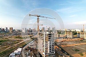 Crane during formworks on construction site. Pouring concrete into formwork. Construction the buildings and multi-storey