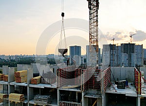 Crane during formworks on construction site. Pouring concrete into formwork. Construction the buildings and multi-storey