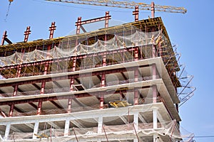 Crane during formworks. Housing renovation concept. View of a large construction site with buildings under construction