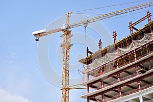 Crane during formworks. Housing renovation concept. View of a large construction site with buildings under construction