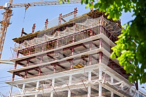 Crane during formworks. Housing renovation concept. View of a large construction site with buildings under construction