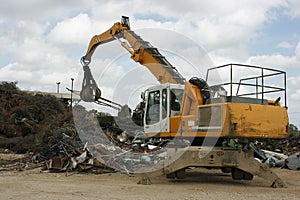 Crane with Grappling Hook at Scrap Yard