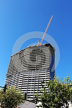 Crane and high-rise building under construction