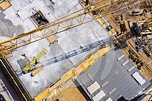 Crane and highrise construction site. aerial View