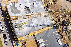 Crane and highrise construction site. aerial View