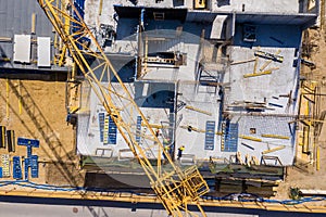 Crane and highrise construction site. aerial View