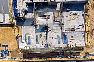 Crane and highrise construction site. aerial View