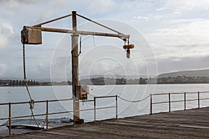 The crane on the historic screwpile jetty pier on Granite Island Victor Harbor South Australia on August 3 2020