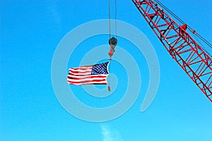 Crane Holding American Flag