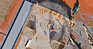 Crane holds wooden roof trusses framework on stick built home the under construction framing