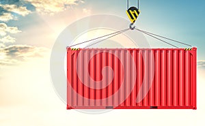 Crane hook and cargo container on sky background