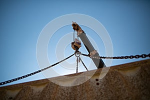 Crane hook connecting with chains and performing lifting heavy duty load construction site