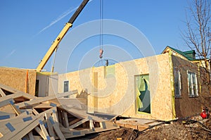 Crane Install SIP panels for Frame House Construction