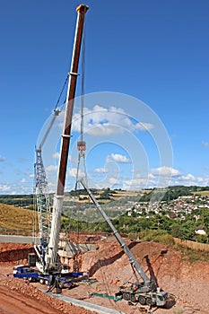 Crane lifting a bridge beam