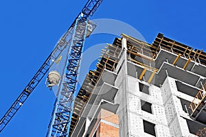 Crane lifting cement mixing container