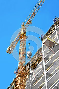 Crane lifting cement mixing container