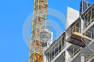 Crane lifting cement mixing container