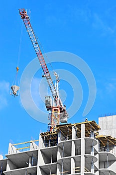 Crane lifting cement mixing container