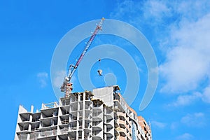 Crane lifting cement mixing container