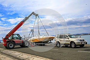 Crane lifts a boat