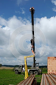 Crane lifts lintel