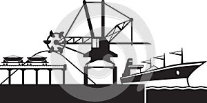 Crane loading industrial ship with ore