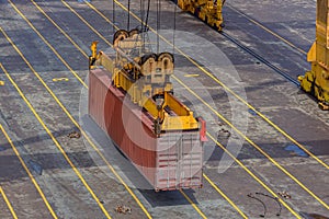 Crane lowering container.