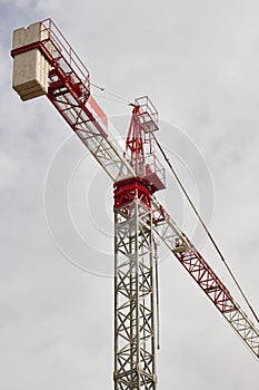 Crane machinery structure under a white sky. Construction industry