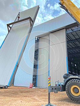 A Crane Maneuvers an 11,000 lb. Sliding Door into Place
