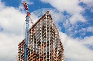 Crane near a skyscraper under construction