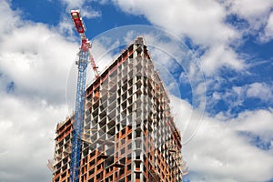 Crane near a skyscraper under construction