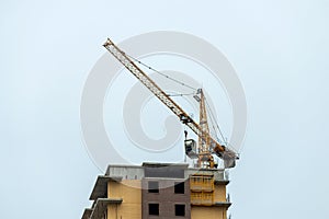 Crane oon a top of construction of a complex of monolithic, multi-storey buildings