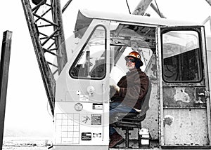 A Crane Operator Devotes Attention to a Lift