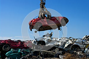 Crane picking up car