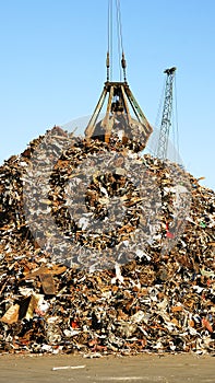 Crane with scrap heap in the port of Barcelona