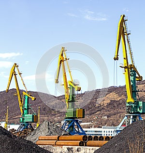 Crane at the scrapyard in the seaport