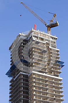 Crane and skyscraper under construction. Toronto, Canada