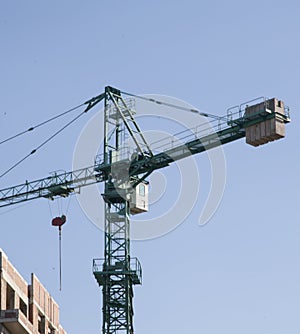 crane tower by the partially constructed building