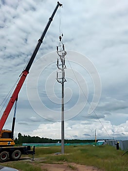 The crane truck is lifting of 115kV Disconnecting switch to the installation point