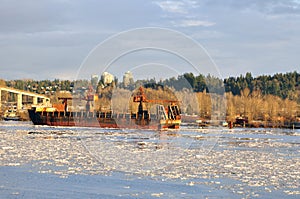 Crane vessel on the icy river